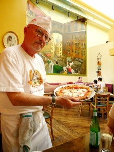 Your host and chef presents a Pizza Margherita hot from the woodfire oven.